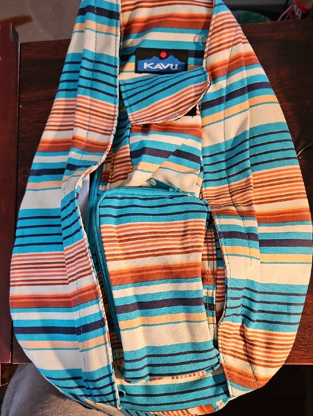 Kavu Striped Sling Pack in Turquoise, Orange & Cream